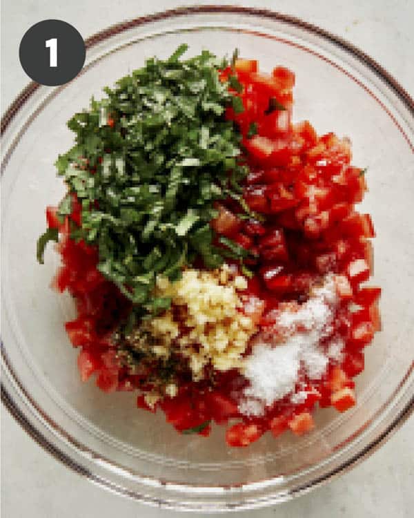 Bruschetta ingredients in a bowl ready to be mixed.