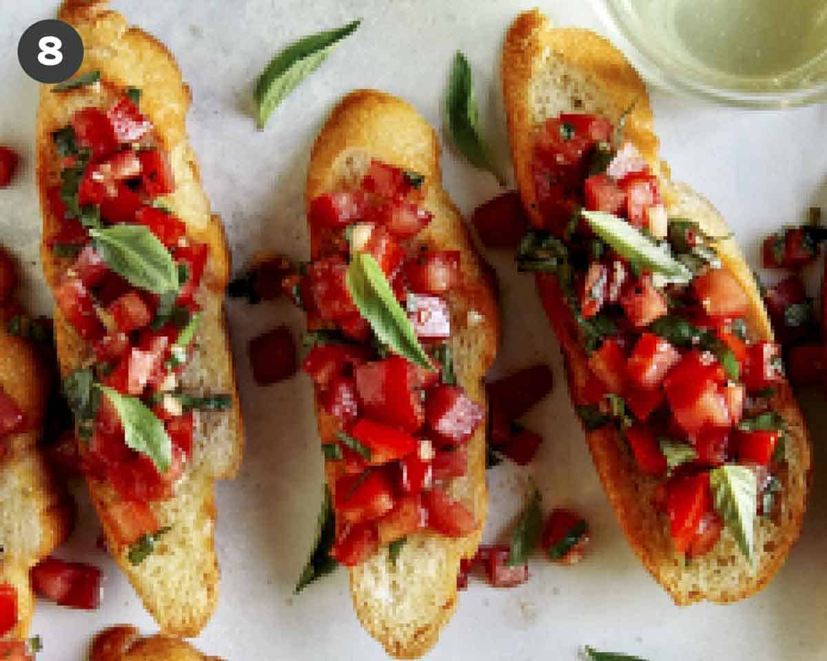 Bruschetta recipe on crostini with basil.