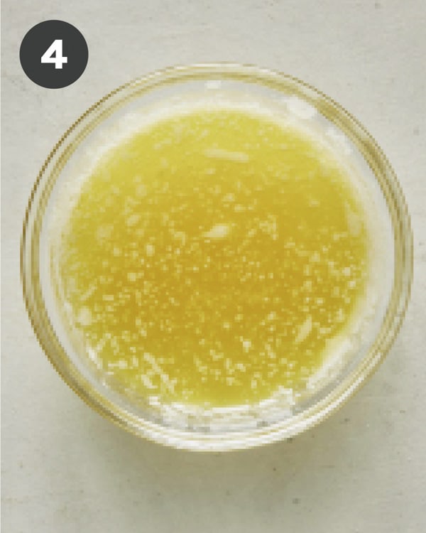 Mixing together butter and oil for bruschetta crostini.