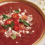 Close up on a bowl of tomato gazpacho.