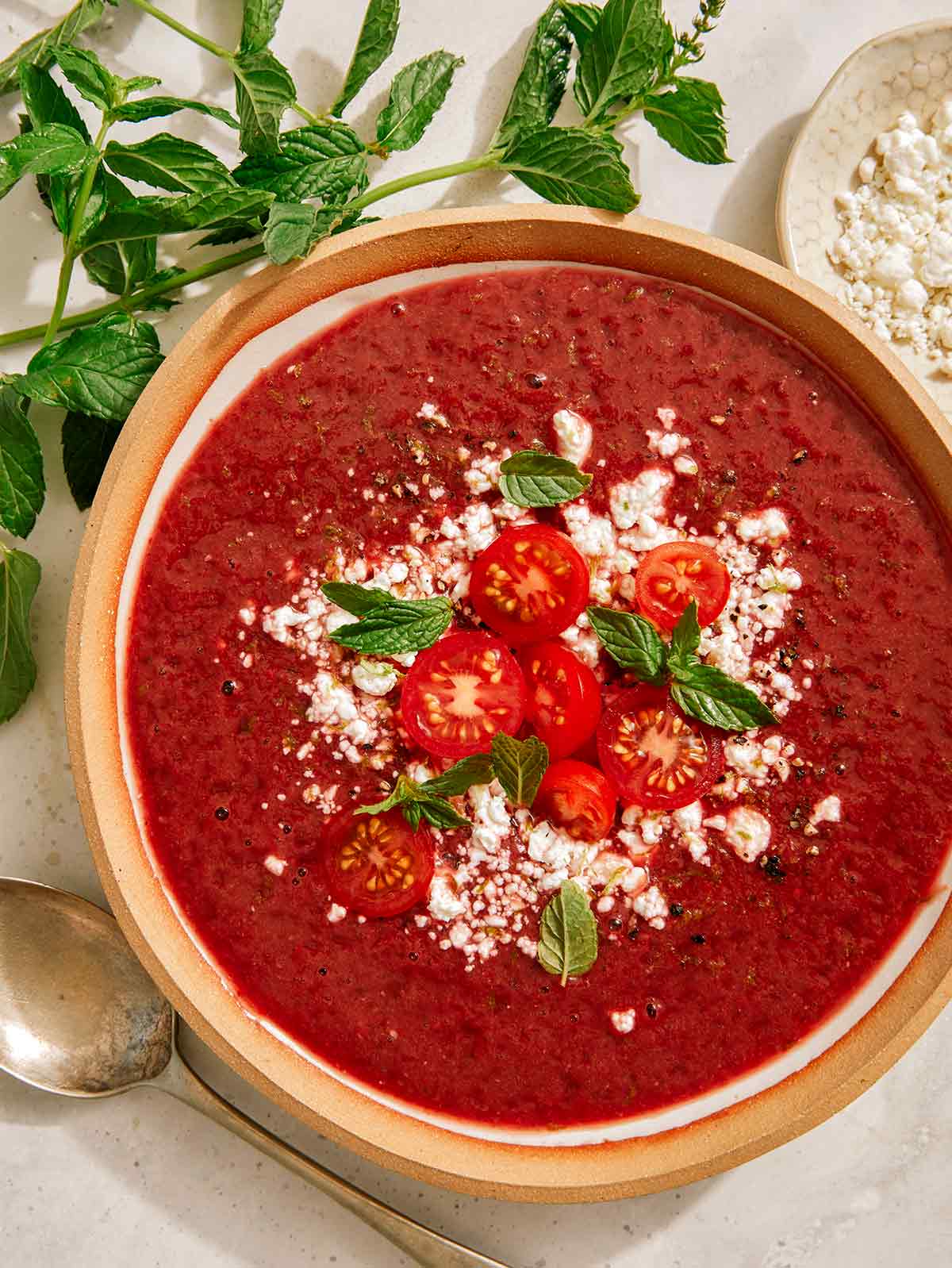 A bowl of strawberry and tomato gazpacho. 