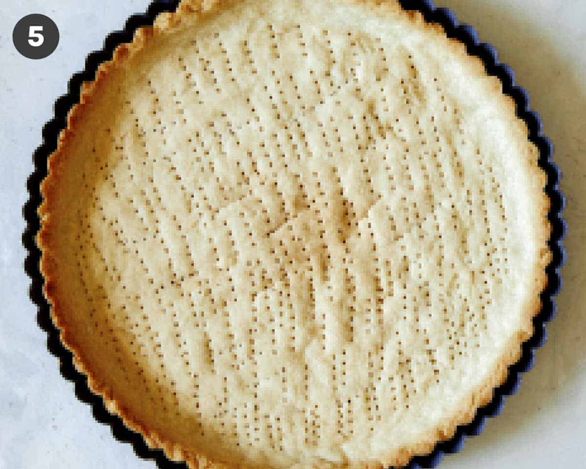 Golden brown tart shell freshly baked.