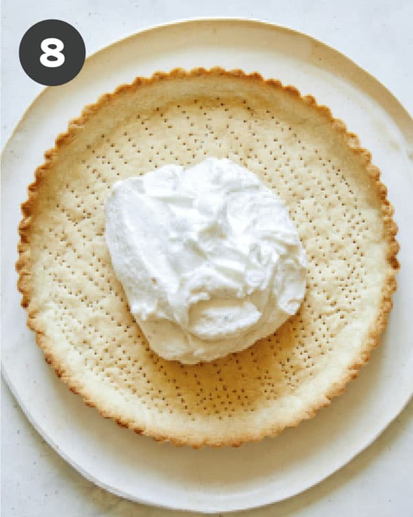Tomato tart shell with filling inside.