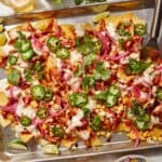 Chipotle chicken nachos on a pan.