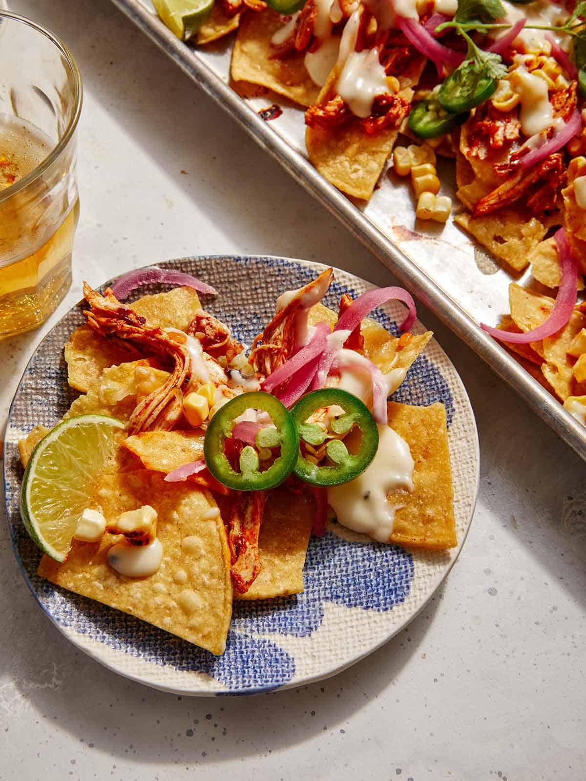 Chipotle chicken sheet pan nachos on a plate. 