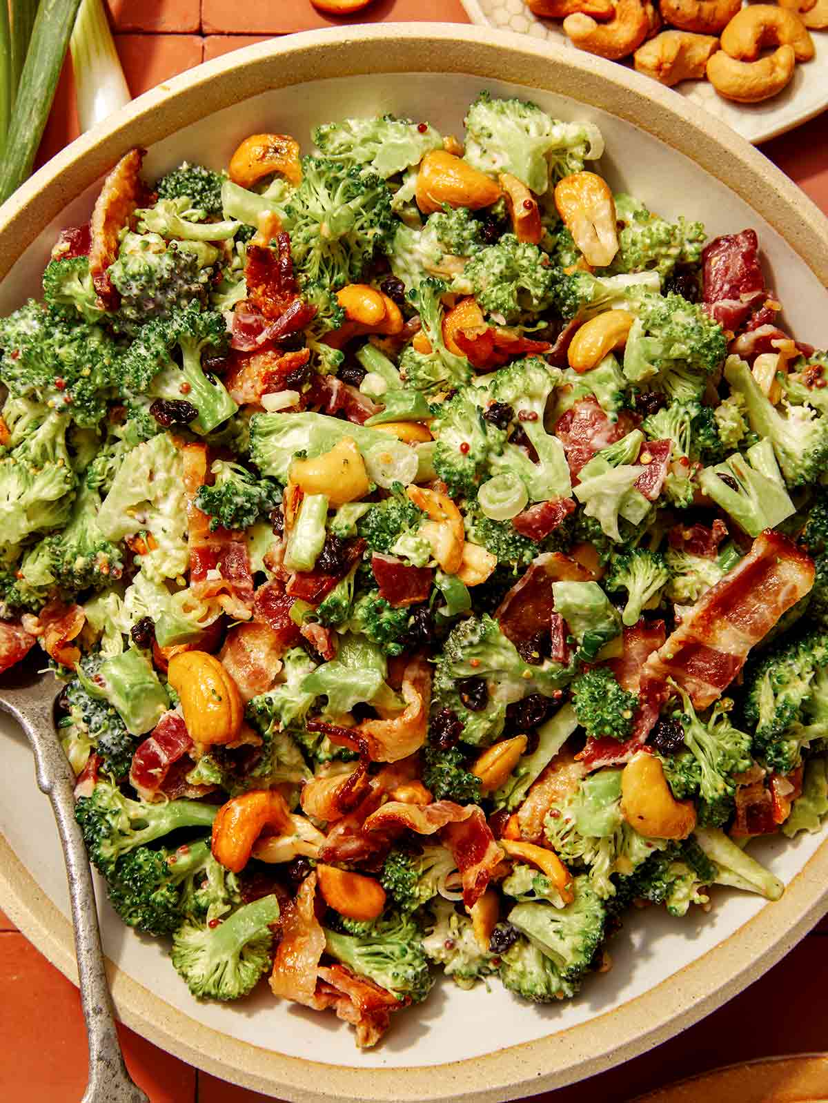 Close up on a broccoli salad recipe in a bowl. 