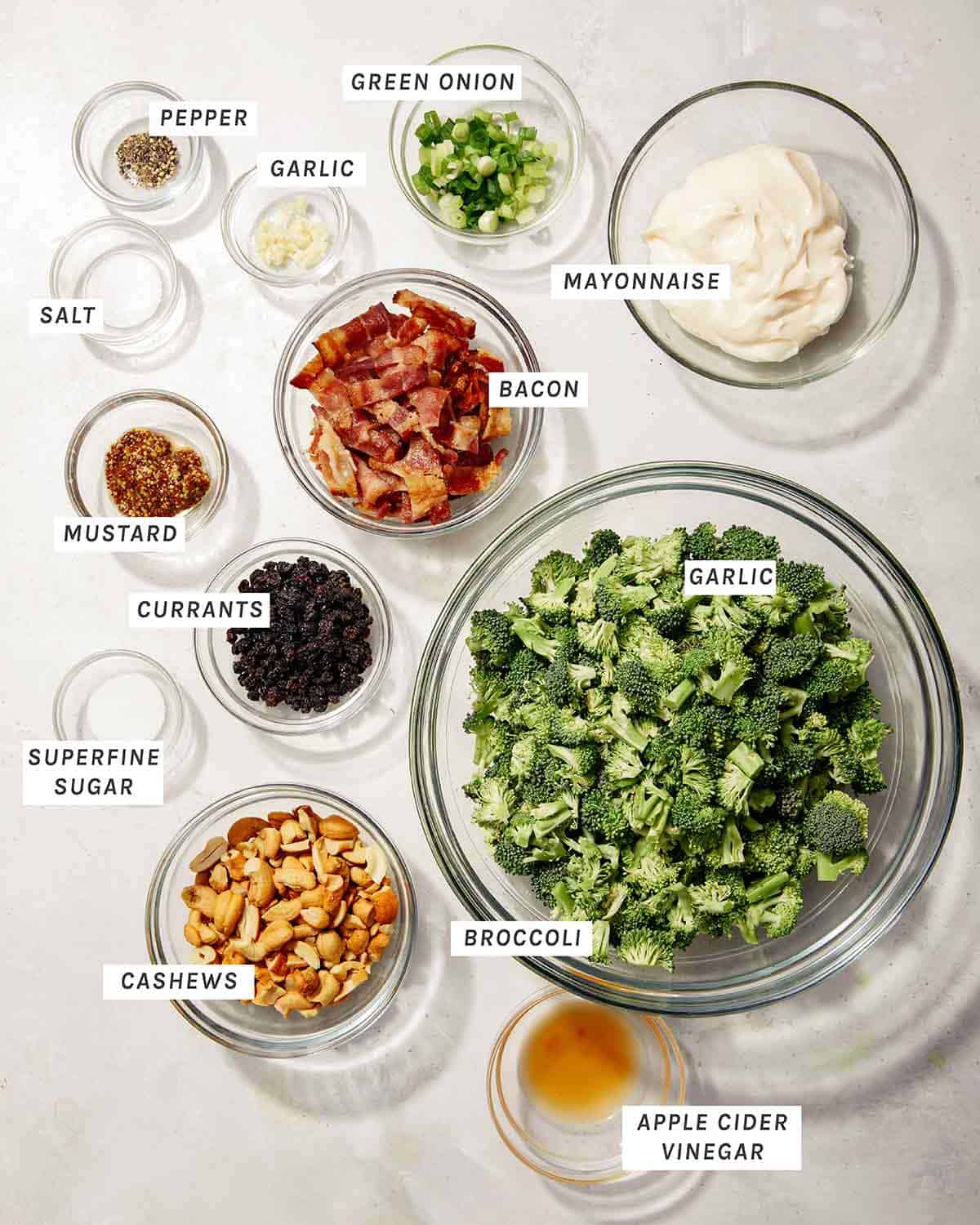 Broccoli salad ingredients on a kitchen table. 