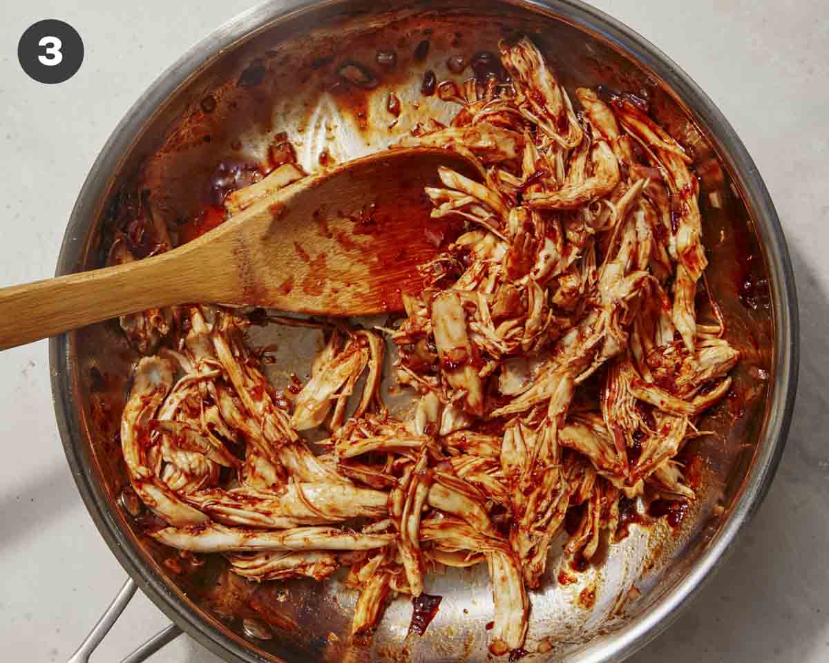 Chicken tossed in a skillet to make chipotle chicken.
