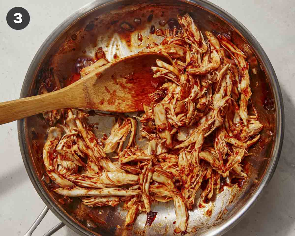 Chicken tossed in a skillet to make chipotle chicken. 