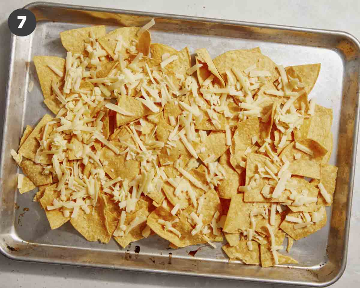 Tortillas with shredded cheese on a pan. 