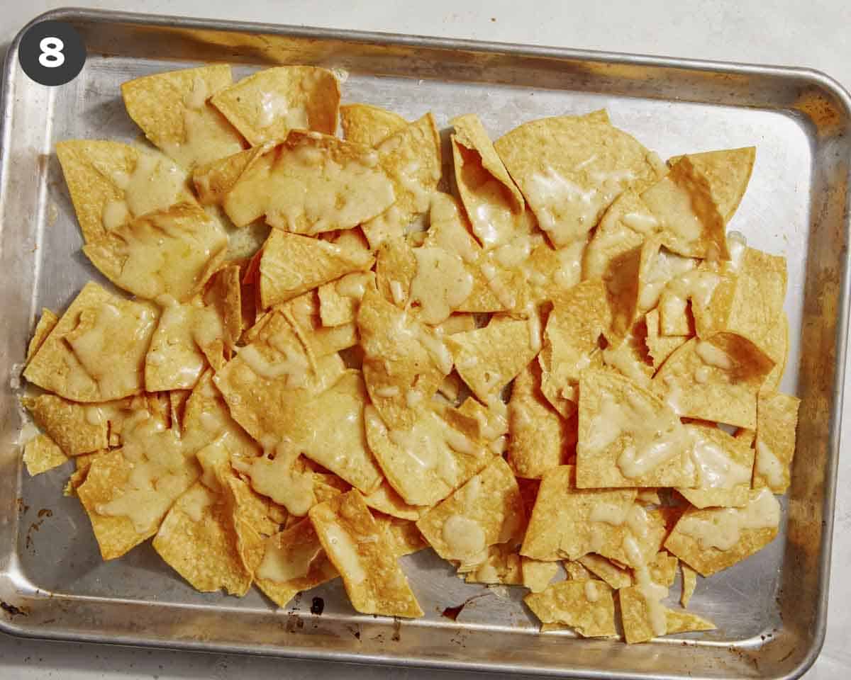 Melted cheese on tortillas to make nachos.