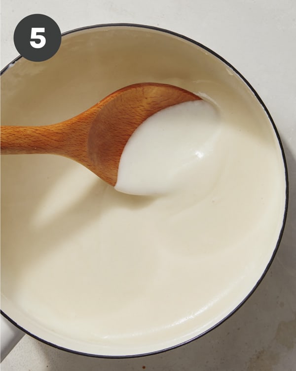 The start of a queso sauce in a pot to make nachos.