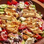 Close up on a greek salad in a wood bow.