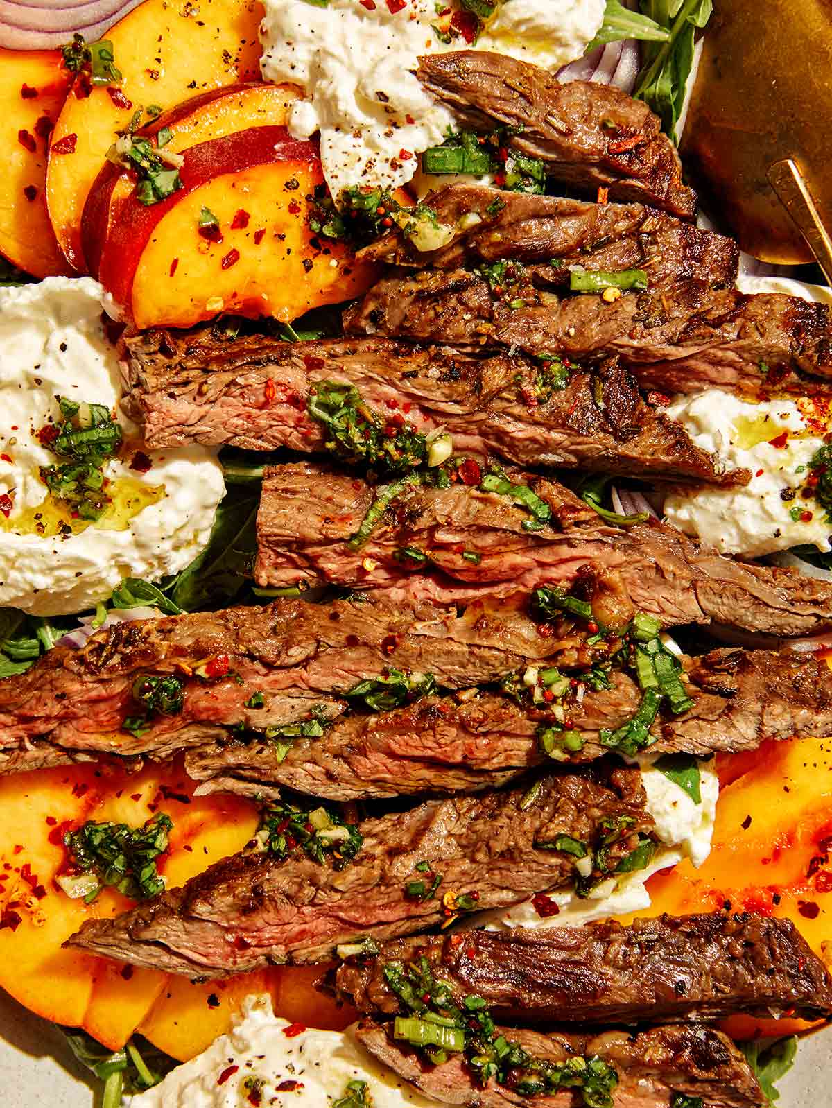 Close up view of grilled skirt steak salad. 