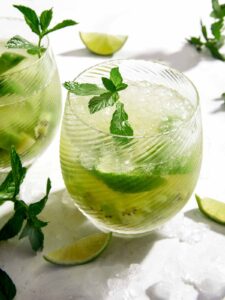 Kiwi Caipiroska recipe in two glasses.