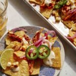 Chipotle chicken sheet pan nachos on a plate.