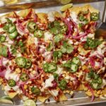 Chipotle chicken sheet pan nacho recipes with beer on the side.