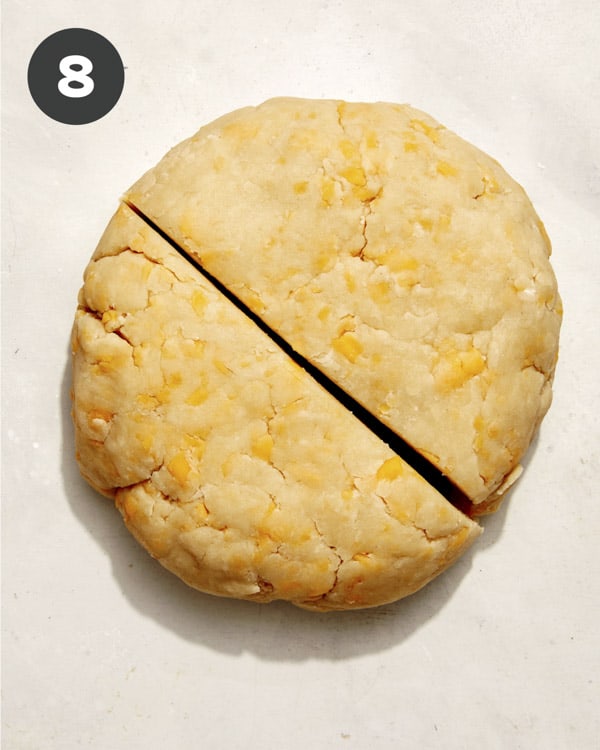 Pie crust being divided into two.