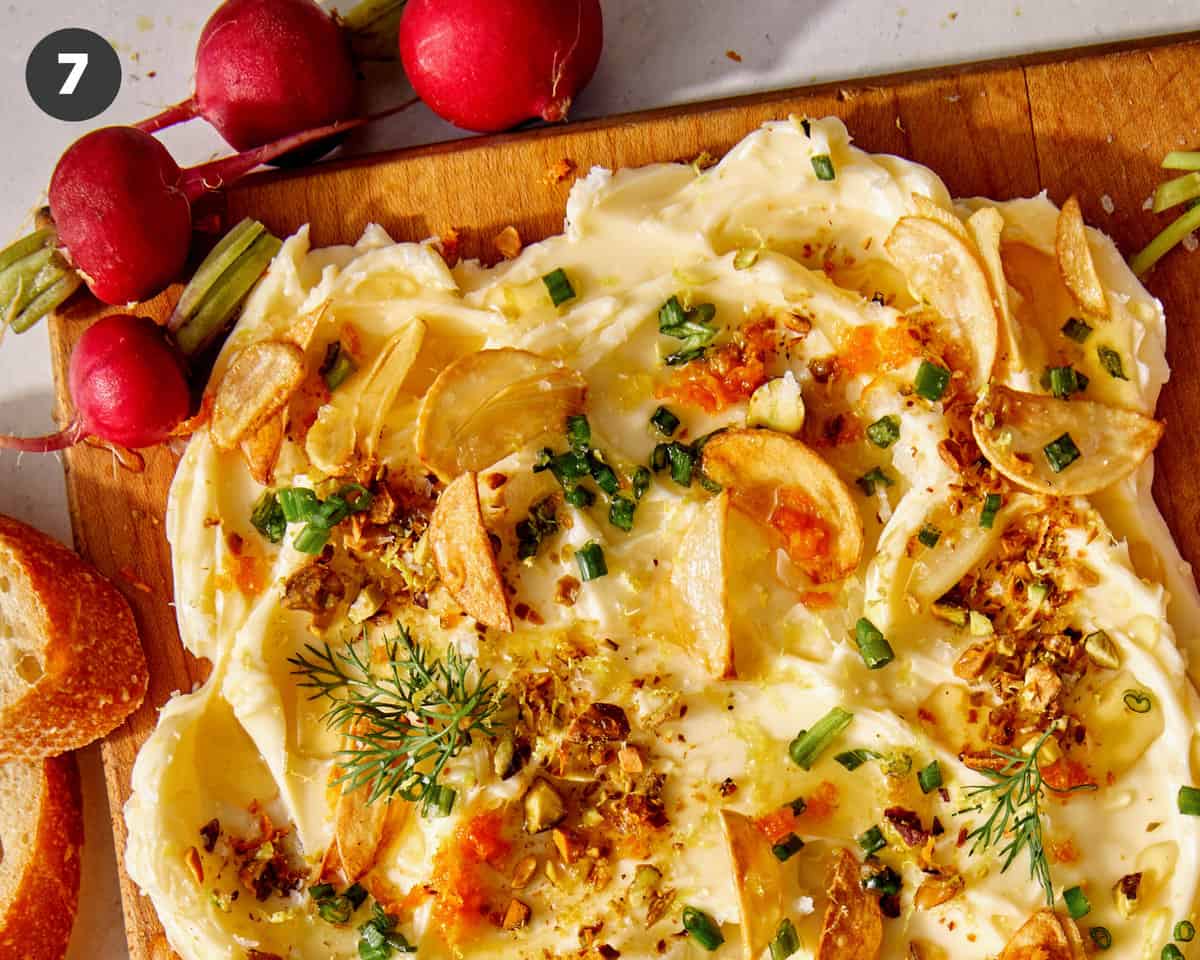 Butter board with radishes and bread. 