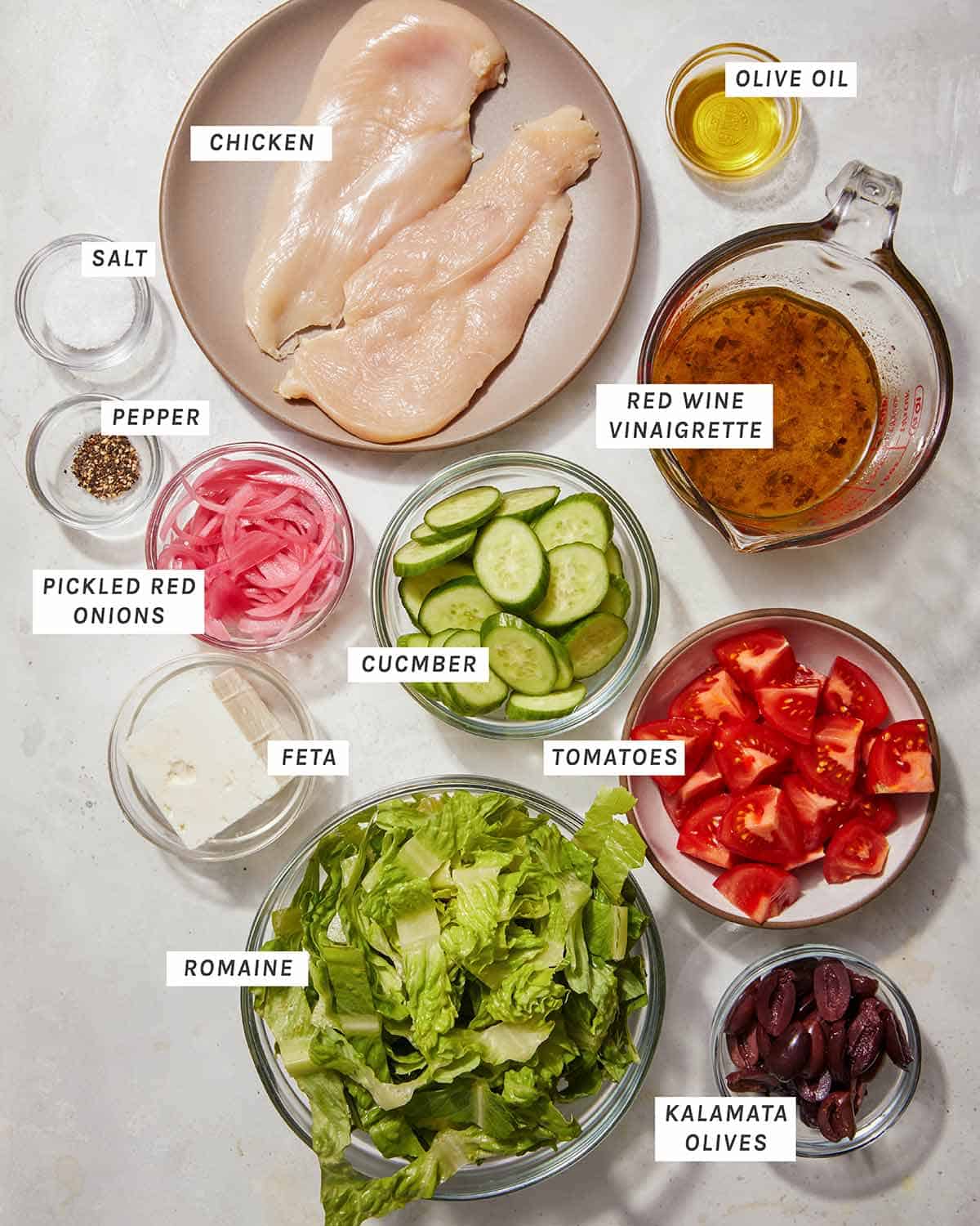 Greek salad ingredients on a kitchen table. 