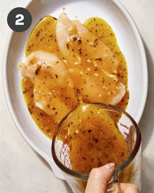 Chicken marinating in red wine vinaigrette.