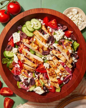 Greek salad recipe in a wooden bowl.