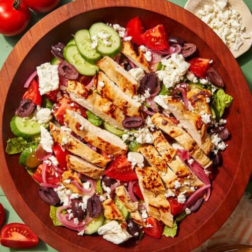 Greek salad recipe in a wooden bowl.