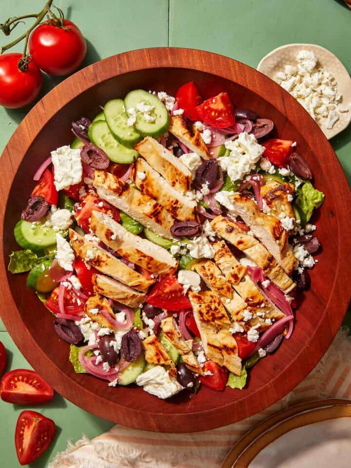 Greek salad recipe in a wooden bowl.