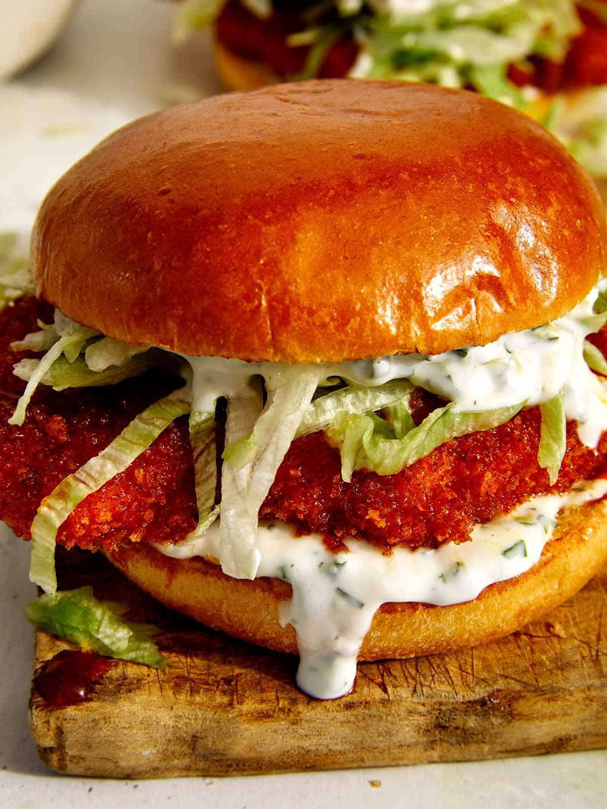 Close up on a hot honey baked chicken sandwich.