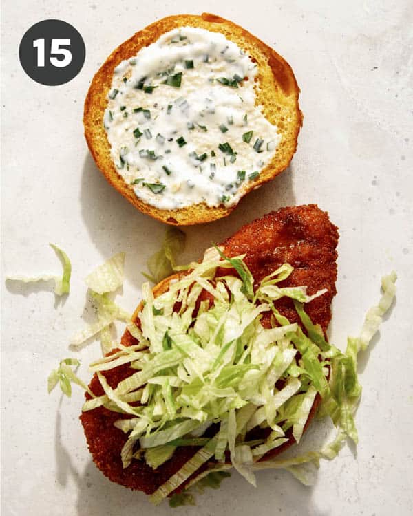 Hot honey chicken sandwich with lettuce on top.