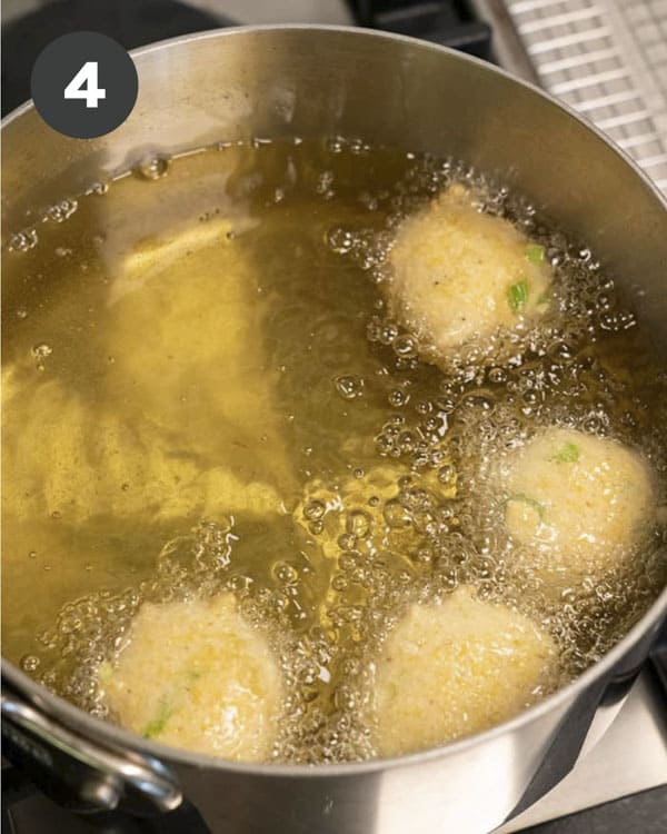 Frying Hush Puppies in a pot with oil.