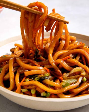 Yaki udon noodle recipe in a bowl with chopsticks.