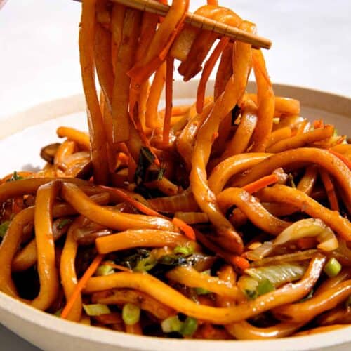 Yaki udon noodle recipe in a bowl with chopsticks.