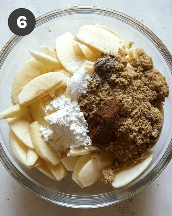 Apple crisp filling ingredients in a bowl.