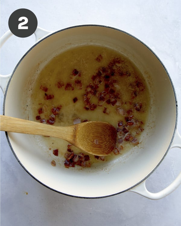 Butter and bacon in a pot to make the start of clam chowder.