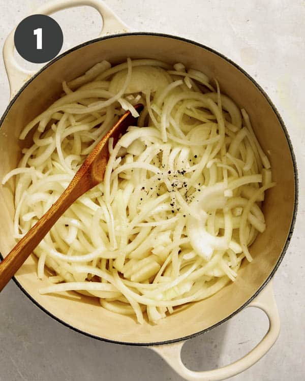 Onions in a pot being cooked down. 