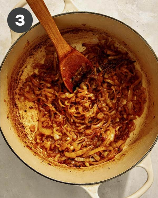 Onions caramelizing in a pot.