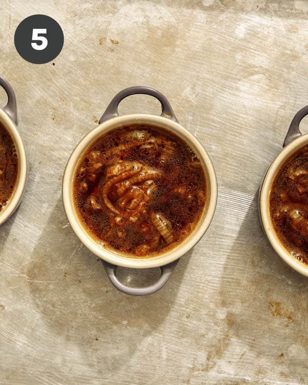 French onion soup ladled into bowls. 
