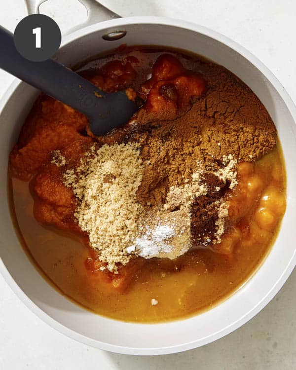 Ingredients to make pumpkin butter in a pot.