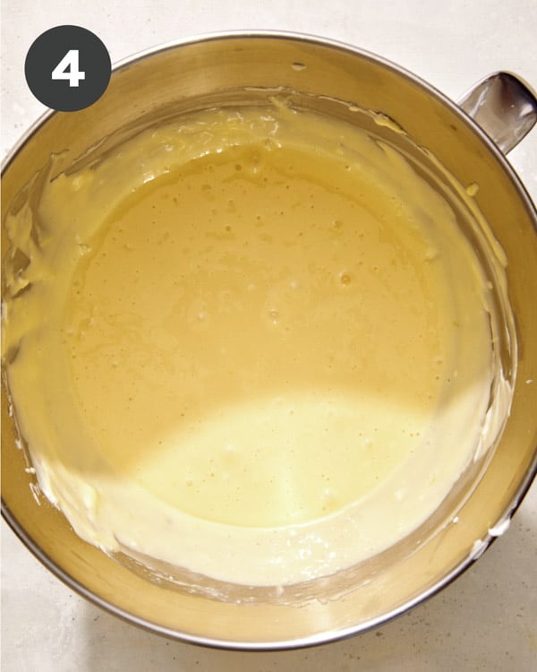 Pumpkin cheesecake filling being mixed in a bowl. 