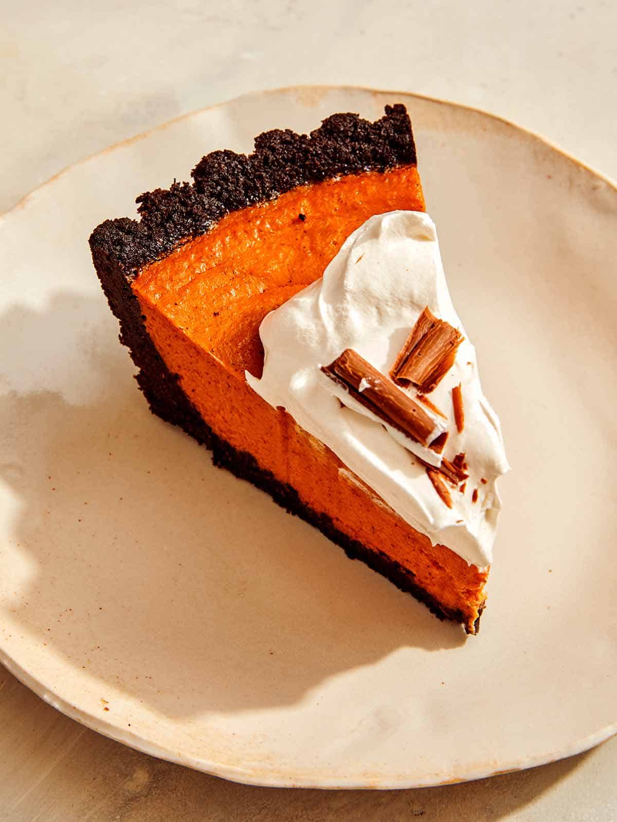 A slice of pumpkin pie on a plate. 