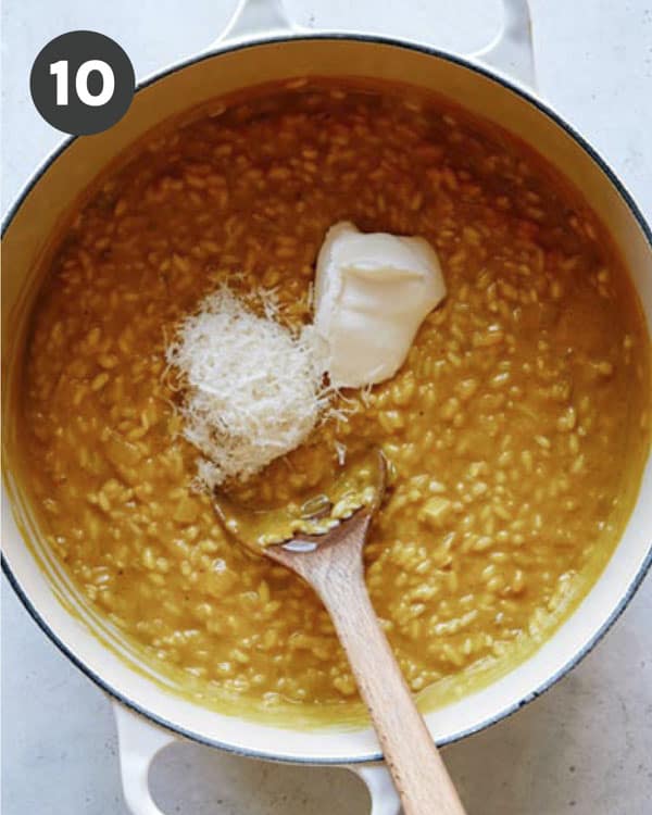 Adding some ingredients to pumpkin risotto.