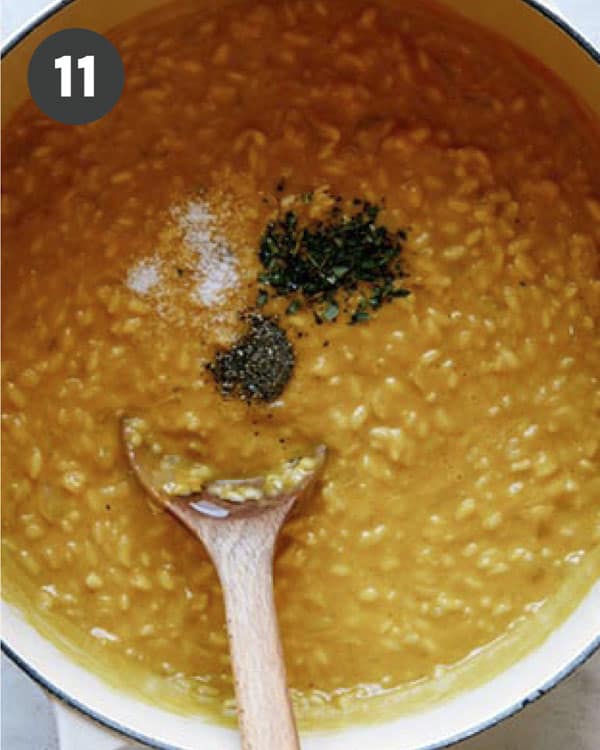 Seasoning pumpkin risotto in a stock pot.