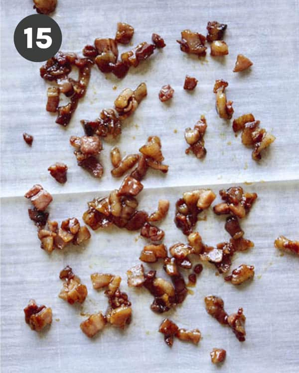 Candied pancetta hardening on a baking sheet.