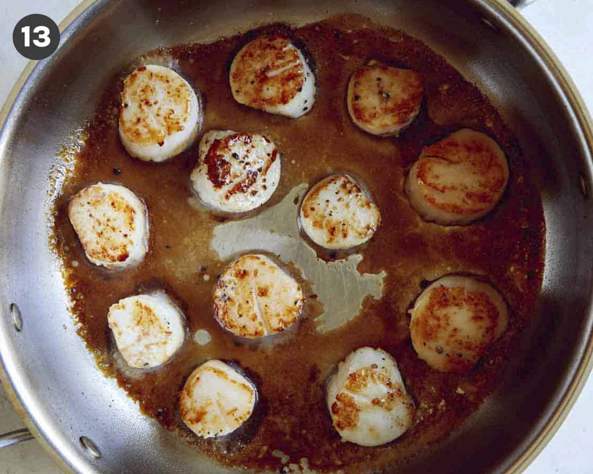 Seared scallops in a skillet. 