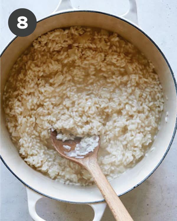 Add all of the broth into the pot until the rice has soaked it all up.