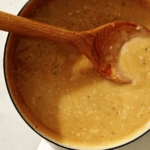 Roasted garlic gravy in a pot.