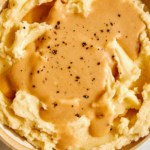 Roasted garlic gravy recipe on mashed potatoes.