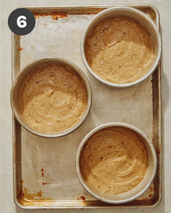 Smash cake batter in cake pans to bake up. 