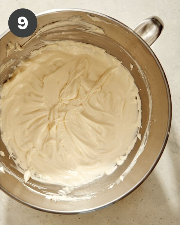 Smash cake frosting recipe in a bowl being mixed together. 